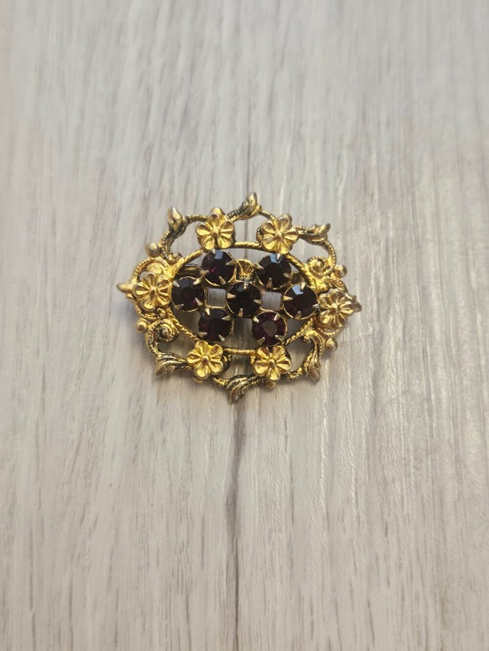 Vintage Gold-Tone Filigree Floral Brooch Pin with Deep Burgundy Rhinestones